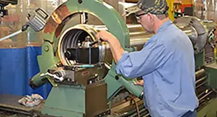 Man working on cylinder